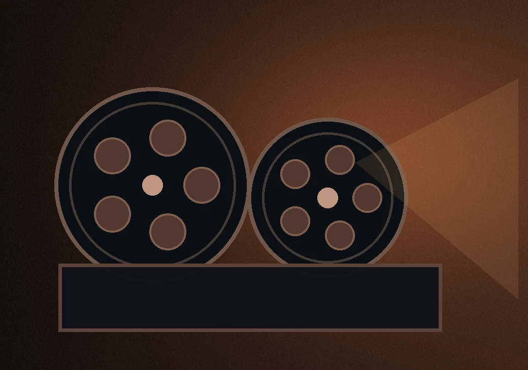 Vintage film reels in warm studio light